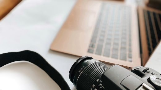 Laptop, camera, desk — Start Strong in Trading by Choosing the Best Forex Markets for Beginners